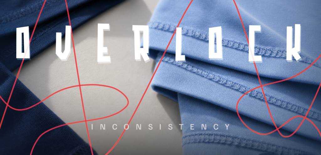 Overlock inconsistency found in a bulk t-shirt sample — loose seam stitching visible on inside fabric edge before bulk order approval